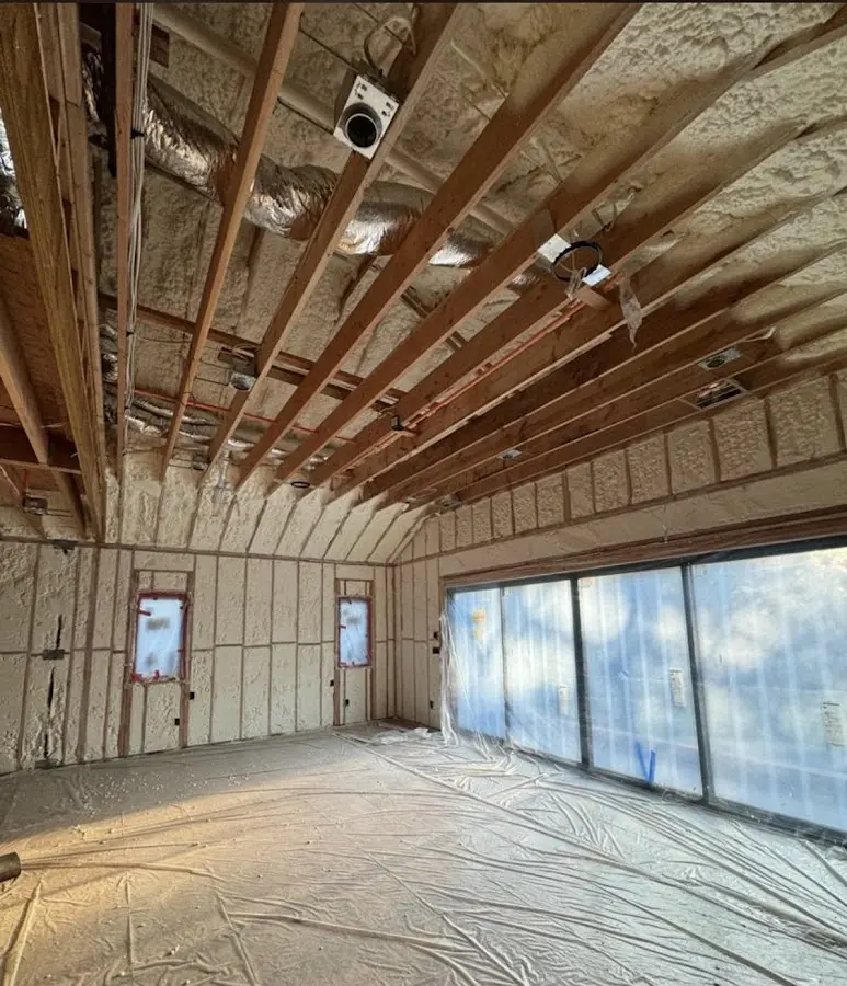 Interior walls and ceiling insulated with spray foam during new construction in Summerfield